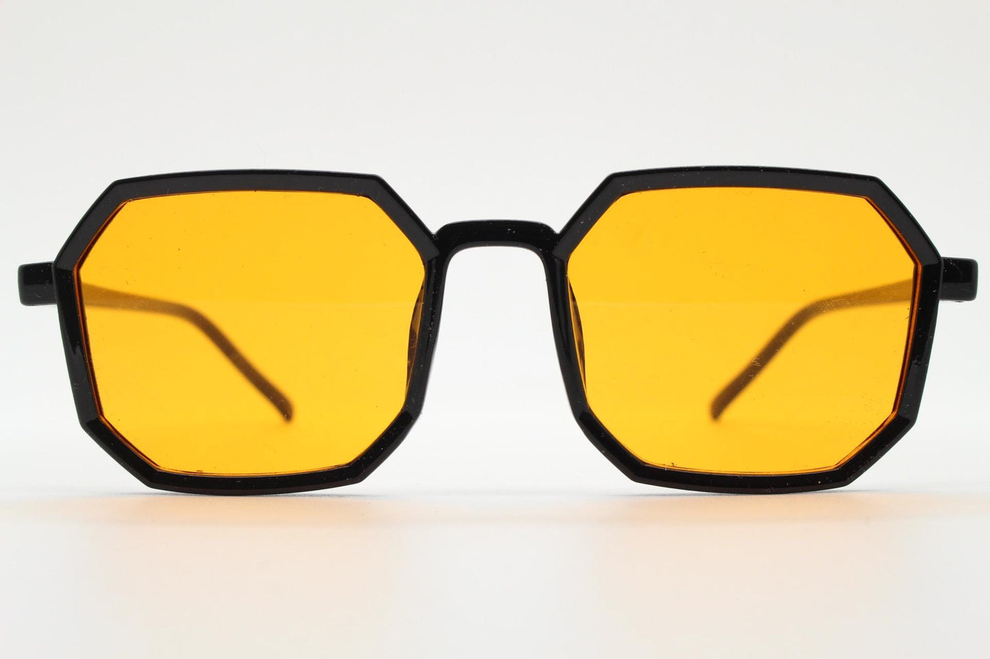 Vintage octagon sunglasses. Well proportioned subtle 8 sided black gloss frame with intense orange lenses. Rave. BNWT. NOS