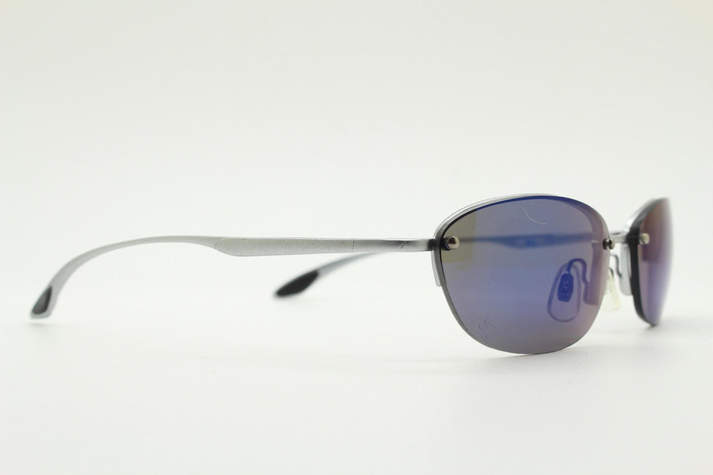 90s vintage small bug eye oval sunglasses. Minimal silver satin finish solid metal half frame with blue mirror lenses. Y2K.  NOS sample
