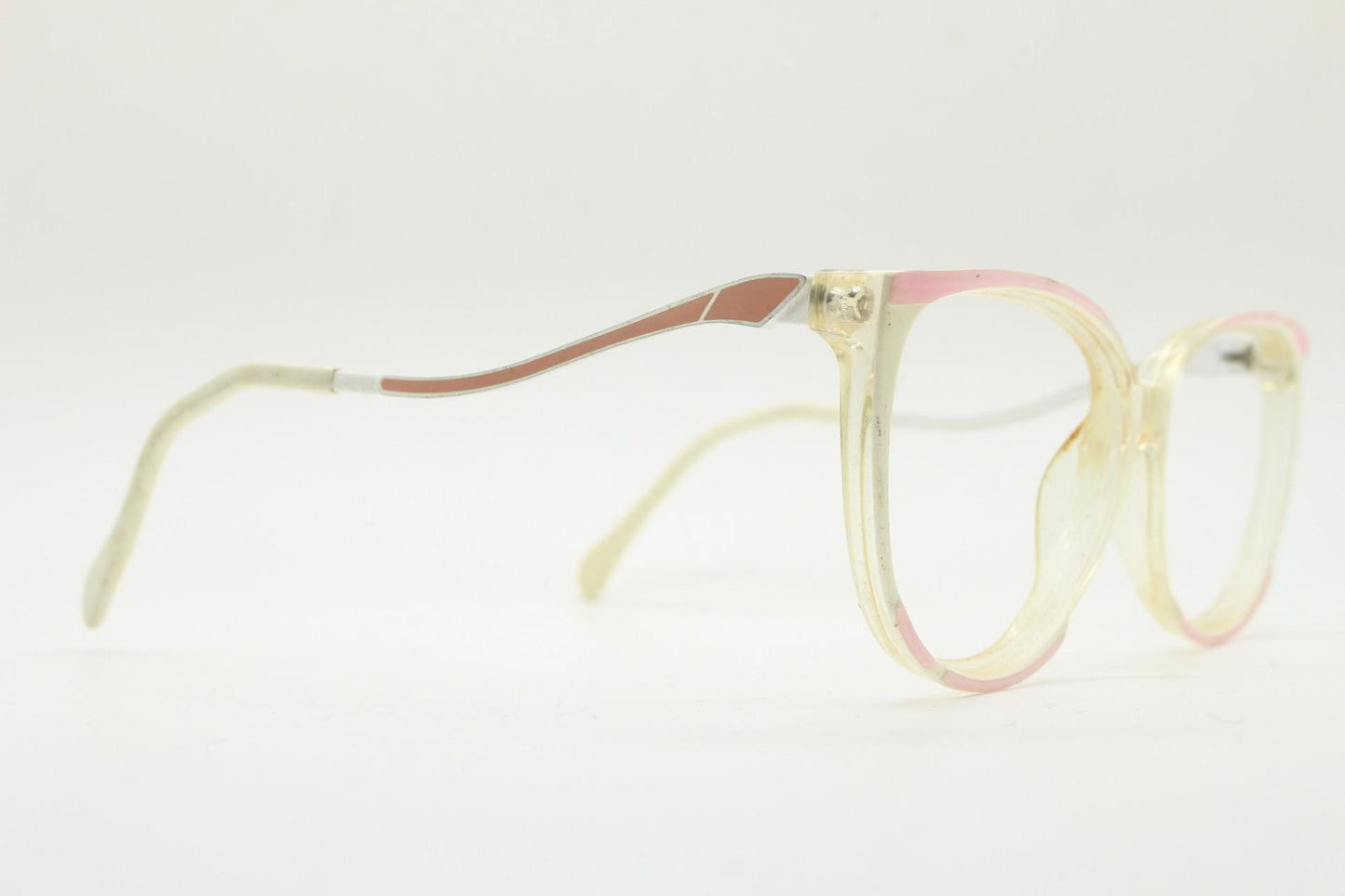 Invicta 80s vintage oversized cat eye glasses made in England. Ice white and pink acetate prescription optical frame with undulating arms