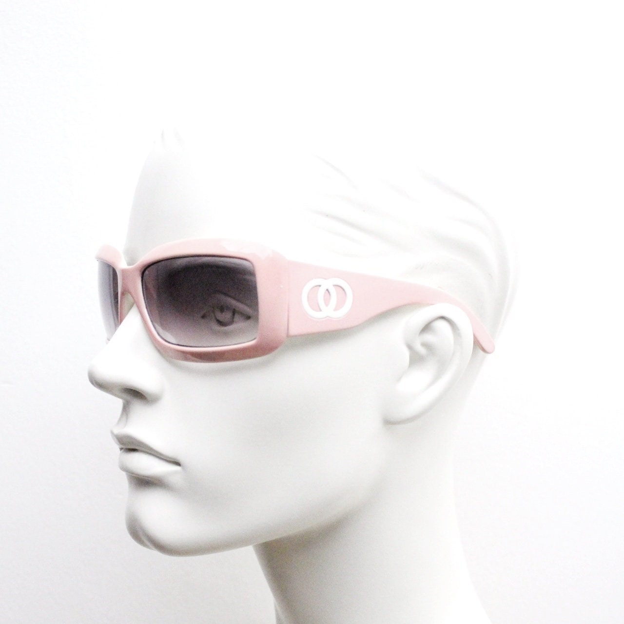 Y2k vintage rectangular wrap around bug eye sunglasses. Curving pink frame with big chain link logo. Rave shield fashion grail. 2000s NOS