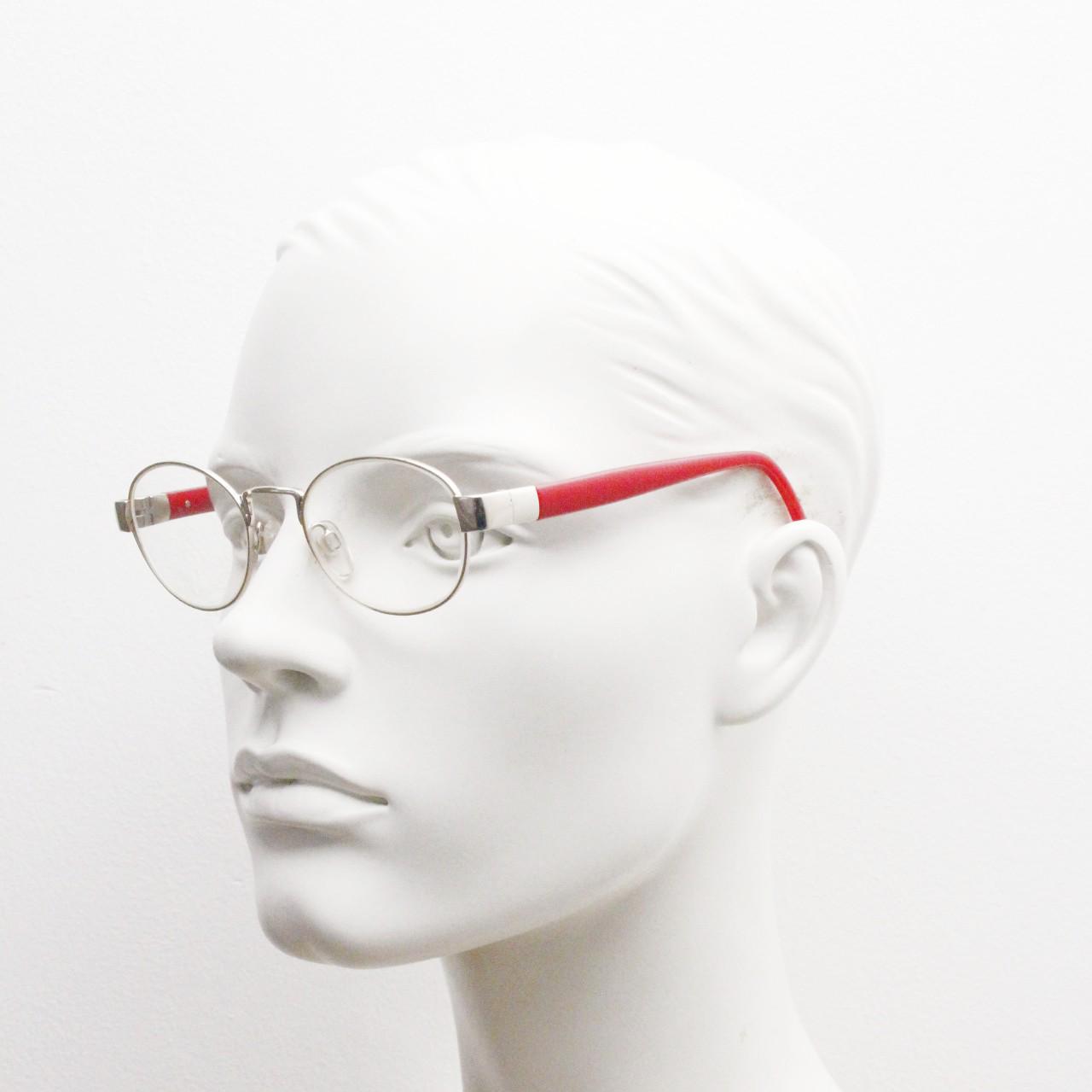 Red or Dead Y2K vintage oval eye glasses. Green or red interchangeable arms on a chrome metal frame. Optical prescription eyeglasses. RX