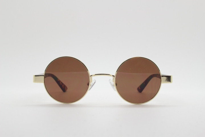 90s round vintage sunglasses. Gold 1920's style frame with tortoise arms and brown lenses. Unused. NOS. Steampunk