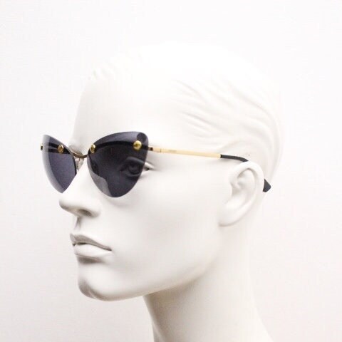 Moschino oval cat eye sunglasses model 082/S. Womens frameless cateye in perfect proportions with golden metal brow line