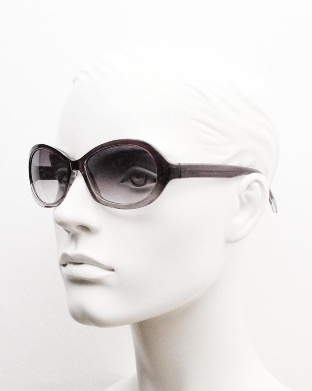 Y2K vintage oval bug eye sunglasses. Tasteful transparent grey acetate frame with matching graduated lenses. 2000s NOS. BNWT