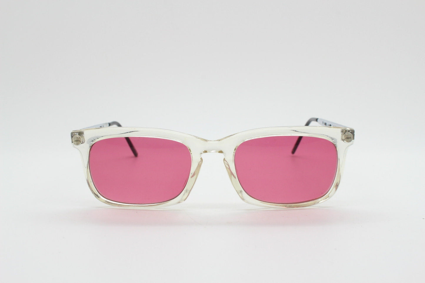 90s vintage futuristic crystal  sunglasses. Rectangular transparent frame with extraordinary arm cut outs and shocking pink lenses. NOS