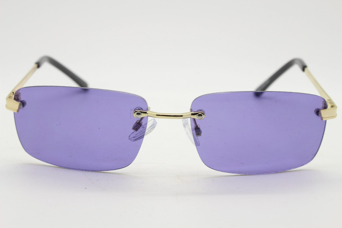 Y2K vintage frameless purple sunglasses. Rectangular lenses with gold bridge and arms. 2000s club kids. 00's. 90s Rave