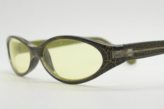 90s vintage abstract oval sunglasses. Thick curve around black frame with psychedelic yellow crackle print. Mini mask. Cosplay NOS