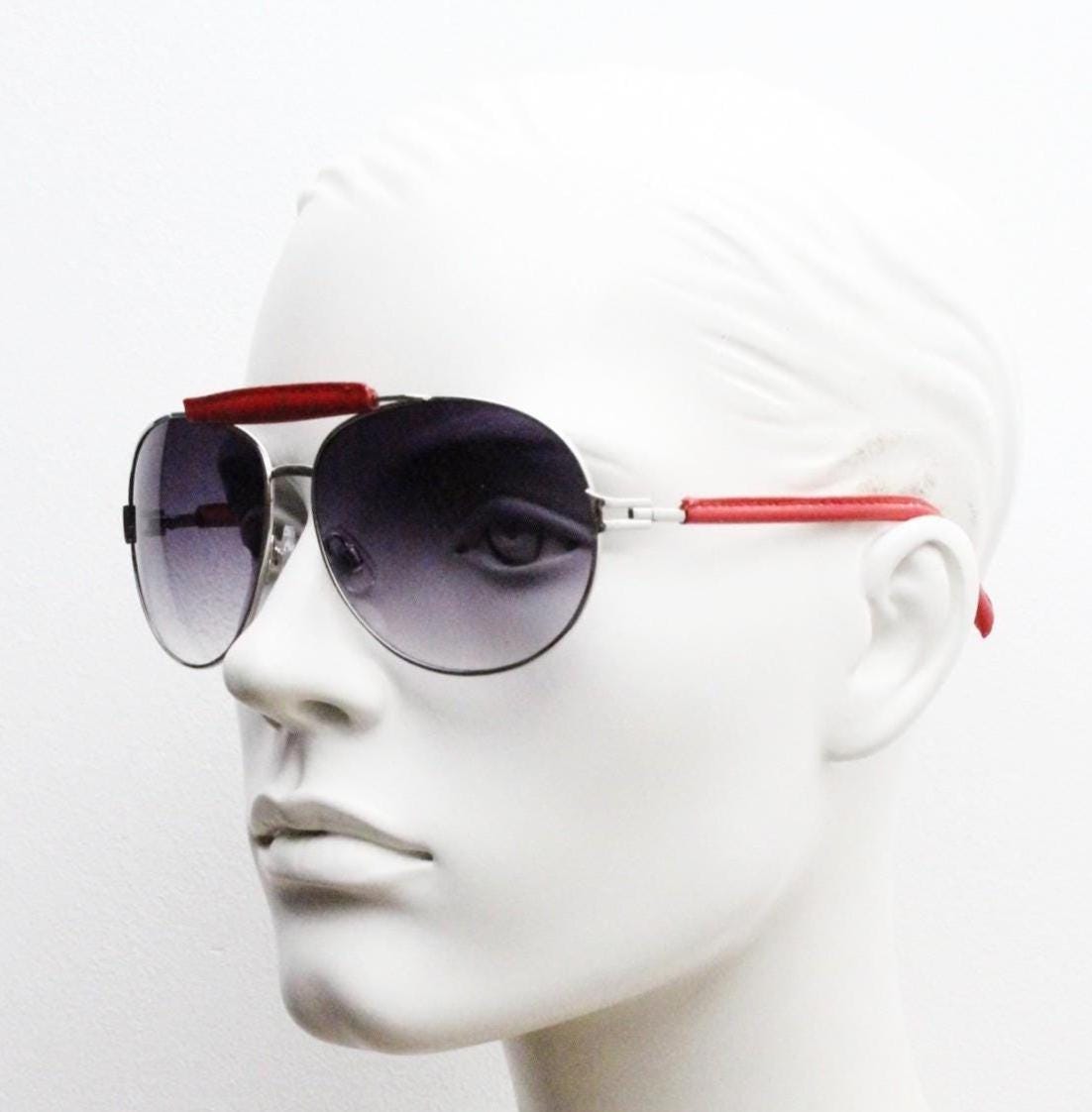 Y2K vintage aviator sunglasses. 2000's silver metal frame with exaggerated bridge in red trim. 70s racing design. 00's NOS aviators