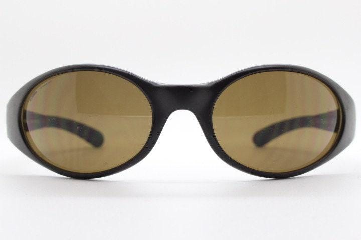Carrera 90s vintage shield sunglasses made in Italy. Aerodynamic brown wrap around sport frame with big spell out logo. Bug eye. BNWT. NOS