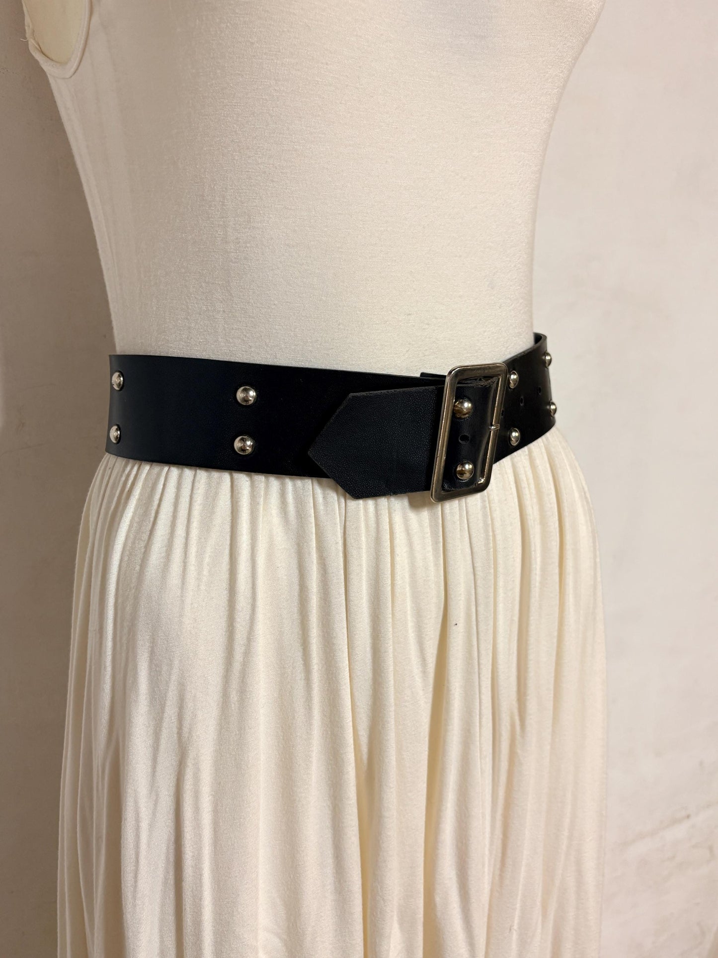 Y2k vintage womens dress belt with flat silver buckle and 2 rows of round domed metal studs. Thick black vinyl 2000s NOS