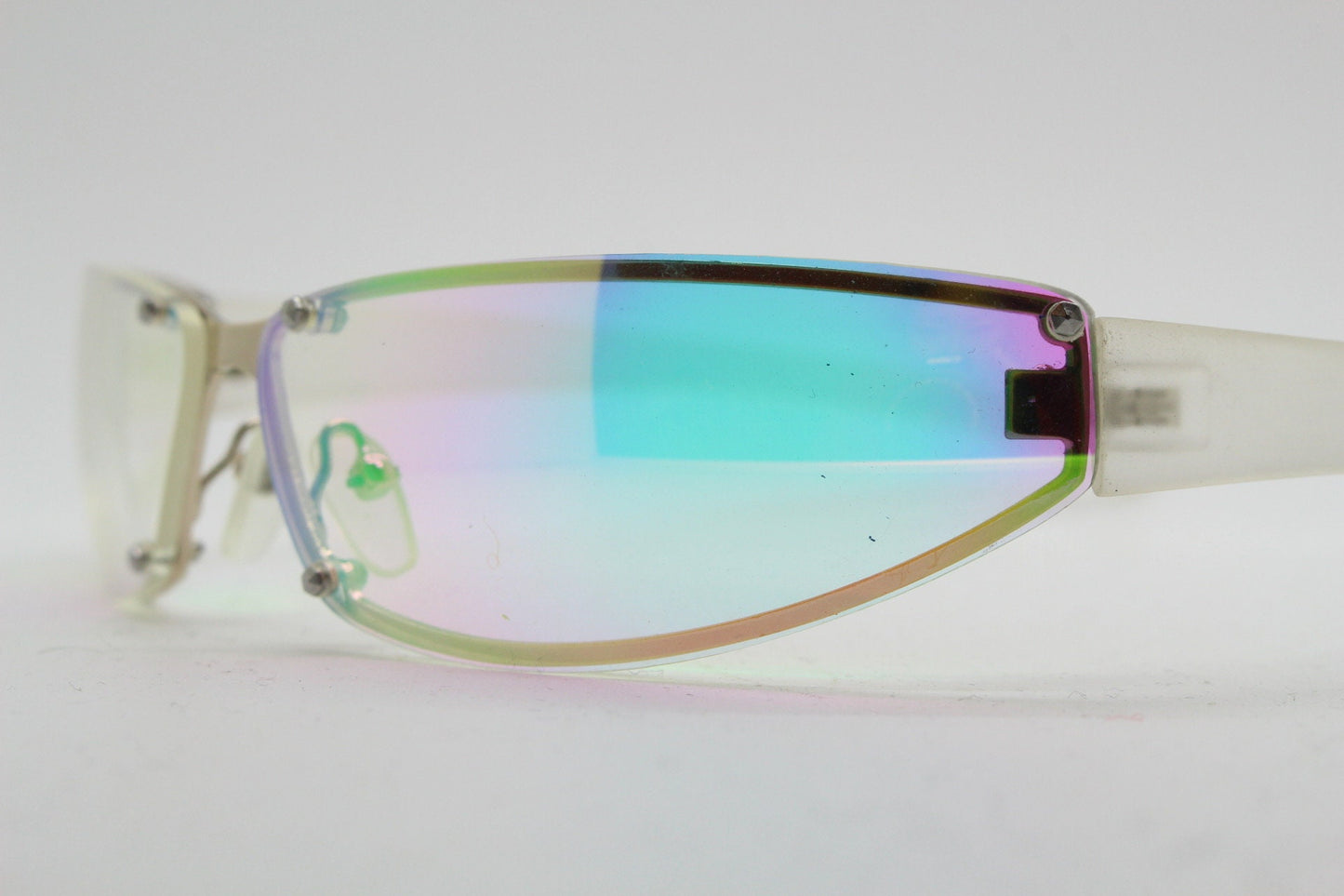 Y2K vintage wraparound sunglasses. Minimal chrome frame with light tone curved gold colour burst mirror lenses. 2000's. 90s. NOS