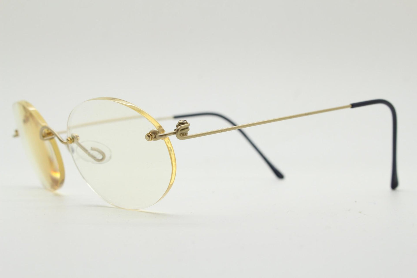 TRY vintage oval frameless eye glasses made in Italy. Futuristic minimal lightweight gold titanium optical frame. RX Spectacles