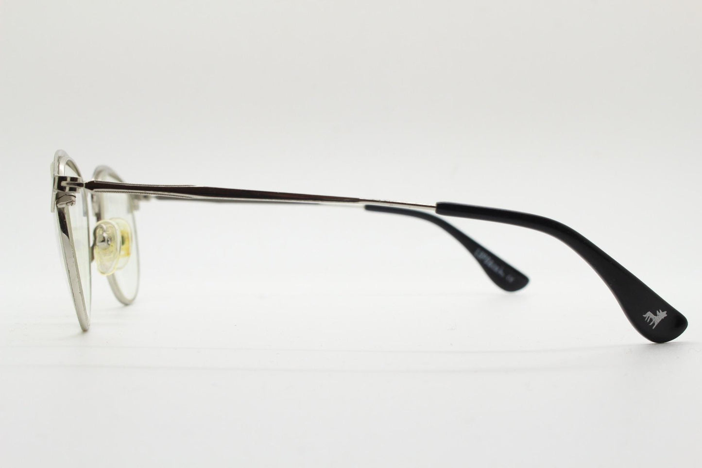 Lupo and Co round eye glasses with pointed corners. Flat metal silver optical frames with black browline. Prescription eyeglasses. RX