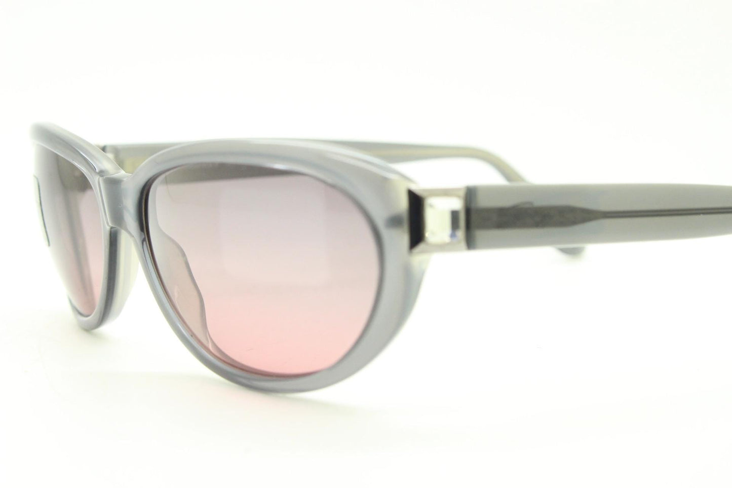 Genny 90s vintage oval cat eye sunglasses made in Italy. Transparent dark grey acetate frame with pink lenses. Womens NOS cateye. BNWT