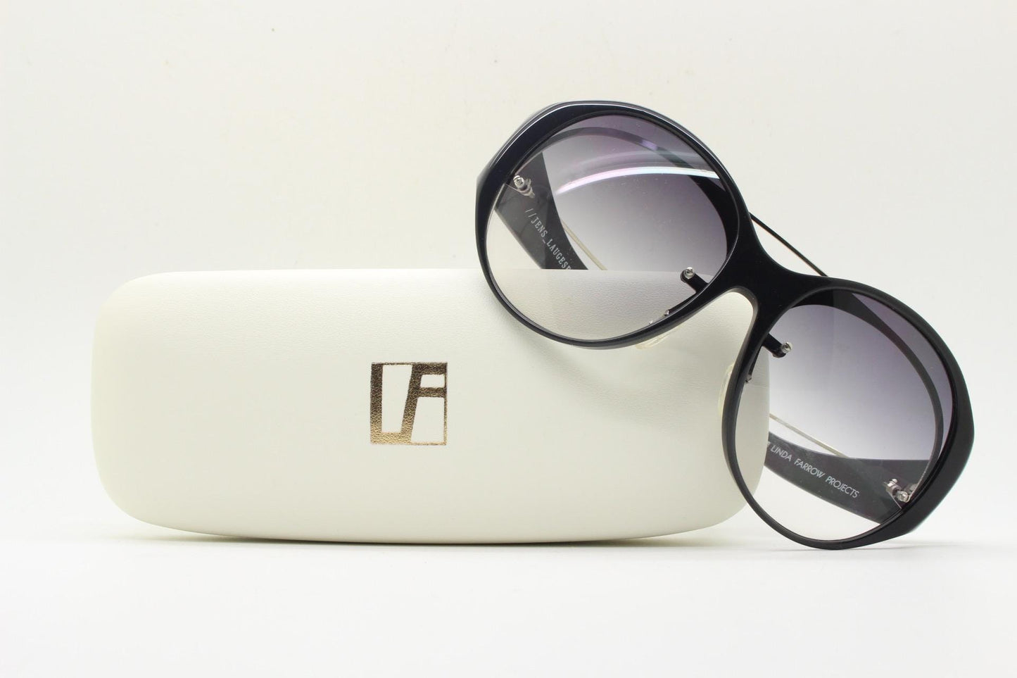 Jens Laugesen oversized sunglasses hand made by Linda Farrow. Black frame with undulating arms and smoky lenses. 70s design. Vintage. NOS