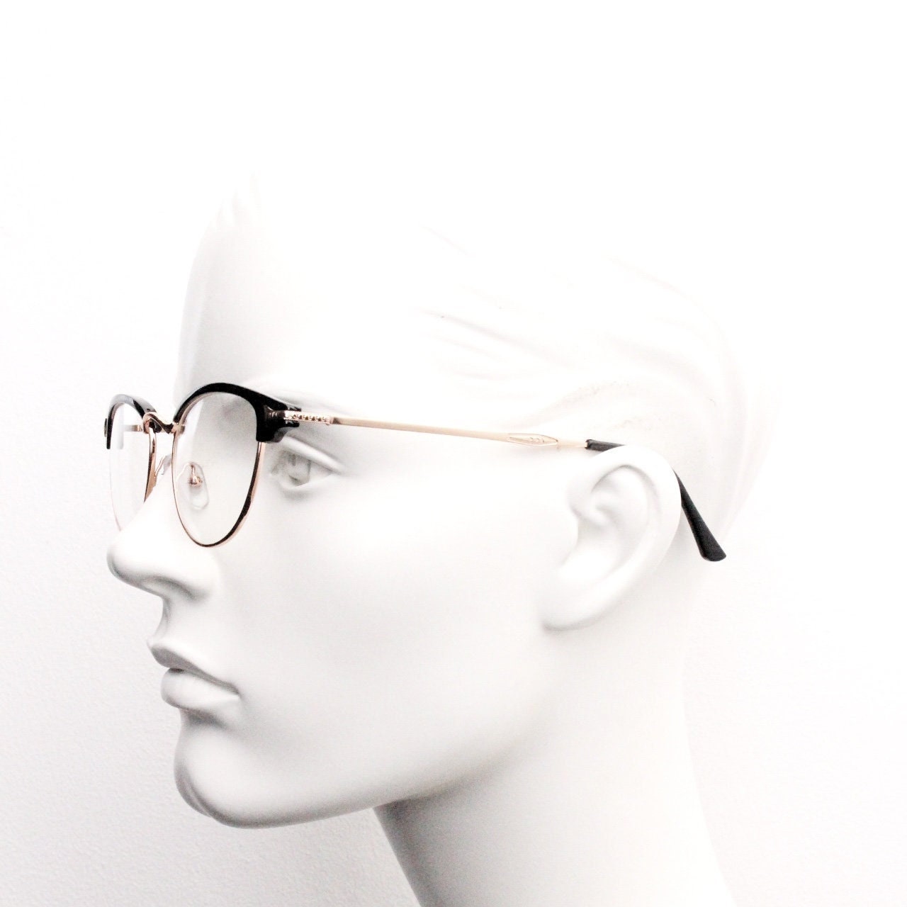 90s vintage browline cat eye glasses. Black gloss and gold half frame eyeglasses. 50s, 60s cateye design with clear lenses. NOS