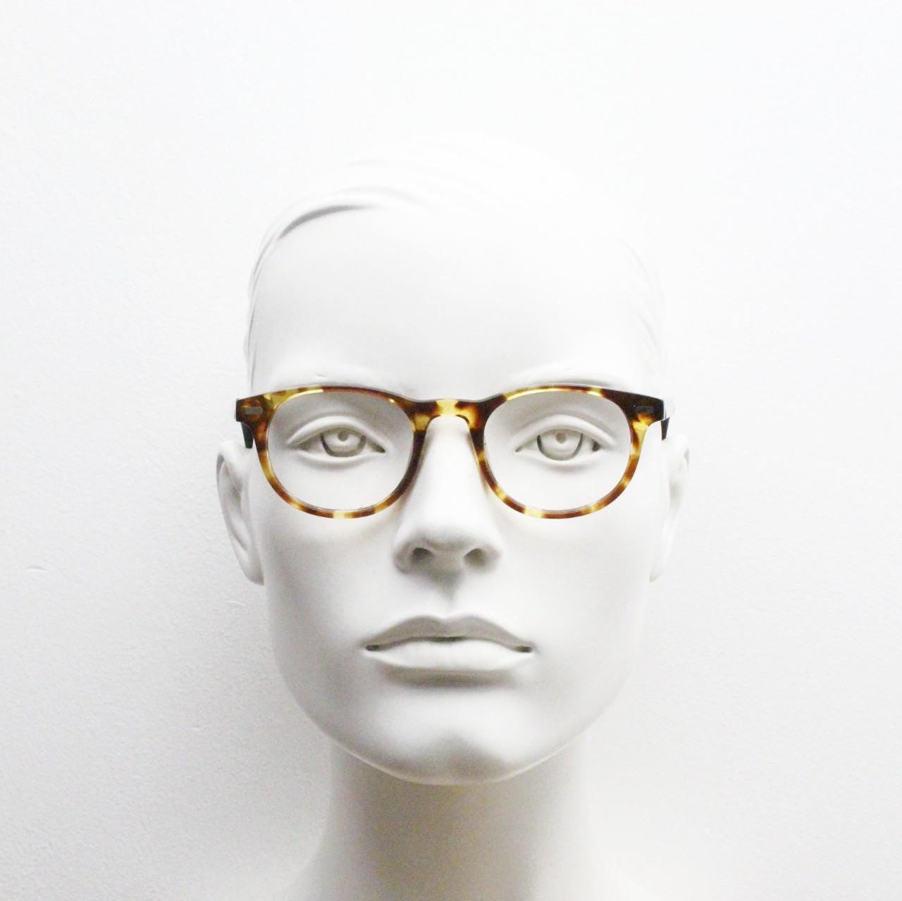 90s Vintage oval eye glasses. Tortoise gloss solid acetate 40s design optical frames with plain black arms. Prescription RX spectacles
