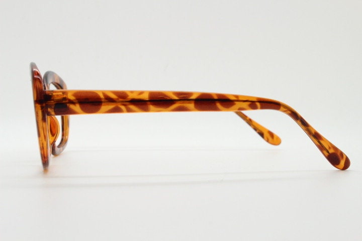90s vintage angular rounded eye glasses. Transparent vibrant amber giraffe pattern optical frame. Womens prescription eyeglasses. RX