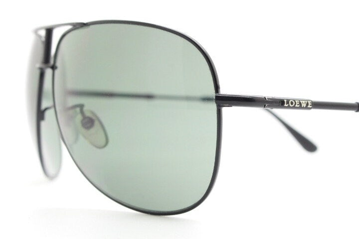 Loewe vintage aviator sunglasses in a tall black gloss frame with dark green lenses. Mens large teardrop pilot aviators. Y2K New Old Stock