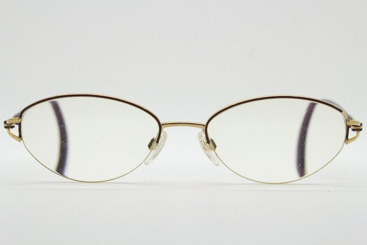 Silhouette oval half frame eye glasses model 6566 made in Austria. Minimal optical frame with gold trim deep purple arms. Prescription RX