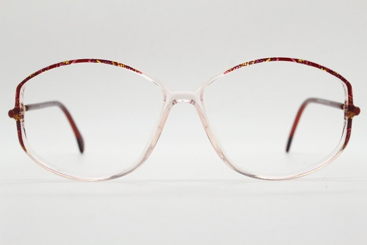 Silhouette 80s vintage hexagon eye glasses made in Austria. Transparent crystal optical frame with abstract red pattern. Prescription RX