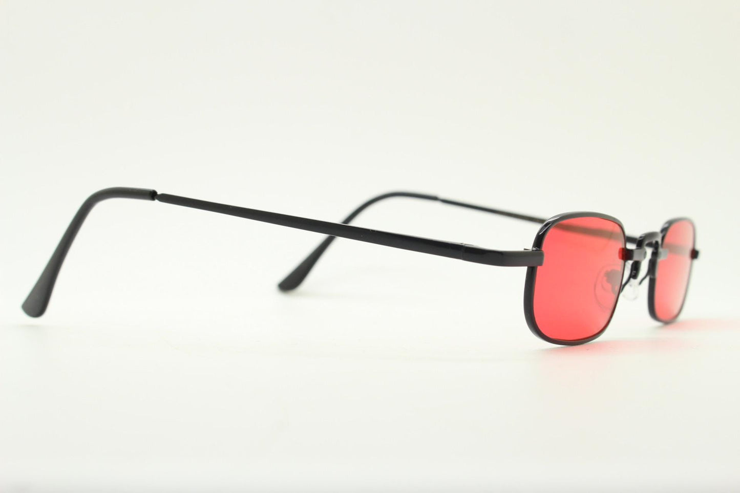 90s vintage small rectangular sunglasses. Imposing minimal black metal victorian style frame with deep red lenses. Unused BNWT