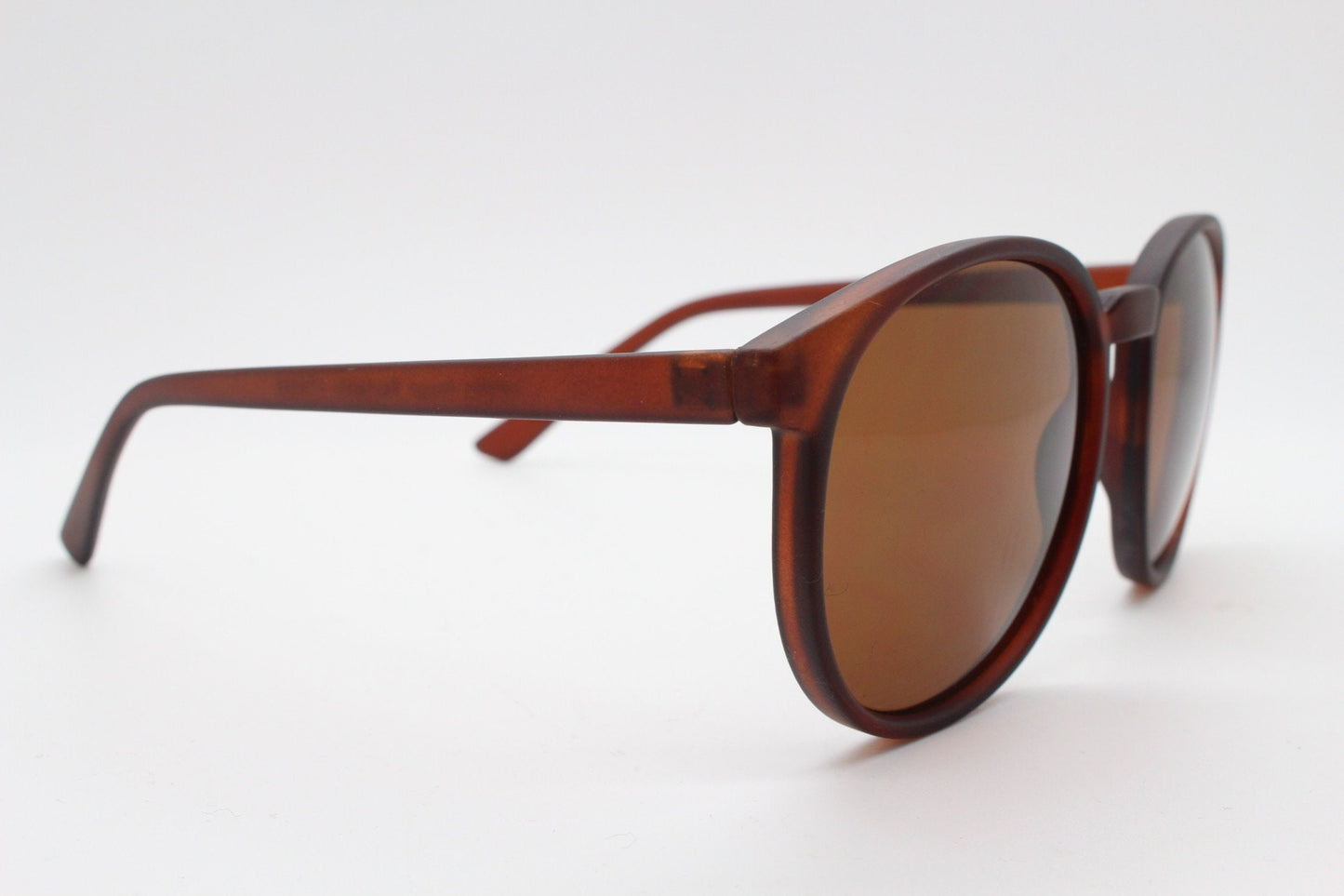 80s vintage round sunglasses. Slightly oversized slim transparent brown frame in a rubber finish with matching lenses. BNWT
