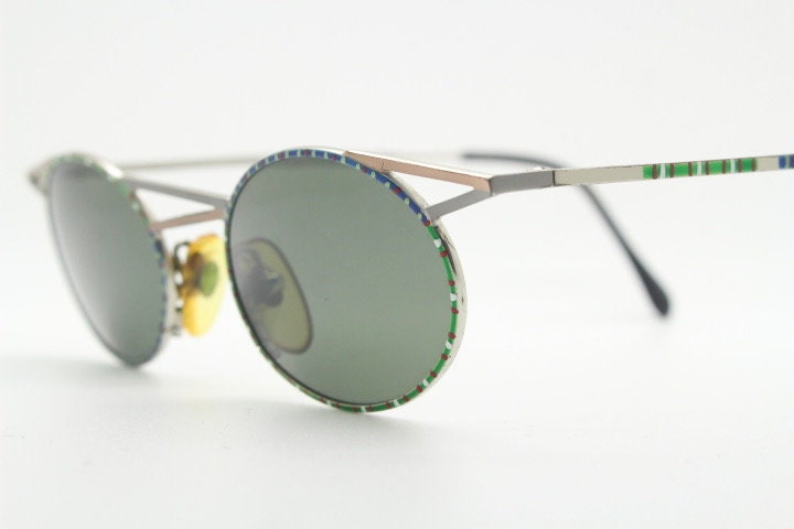 Taxi 90s vintage oval sunglasses. Unique innovative abstract design with extraordinary multi colour print. Casanova