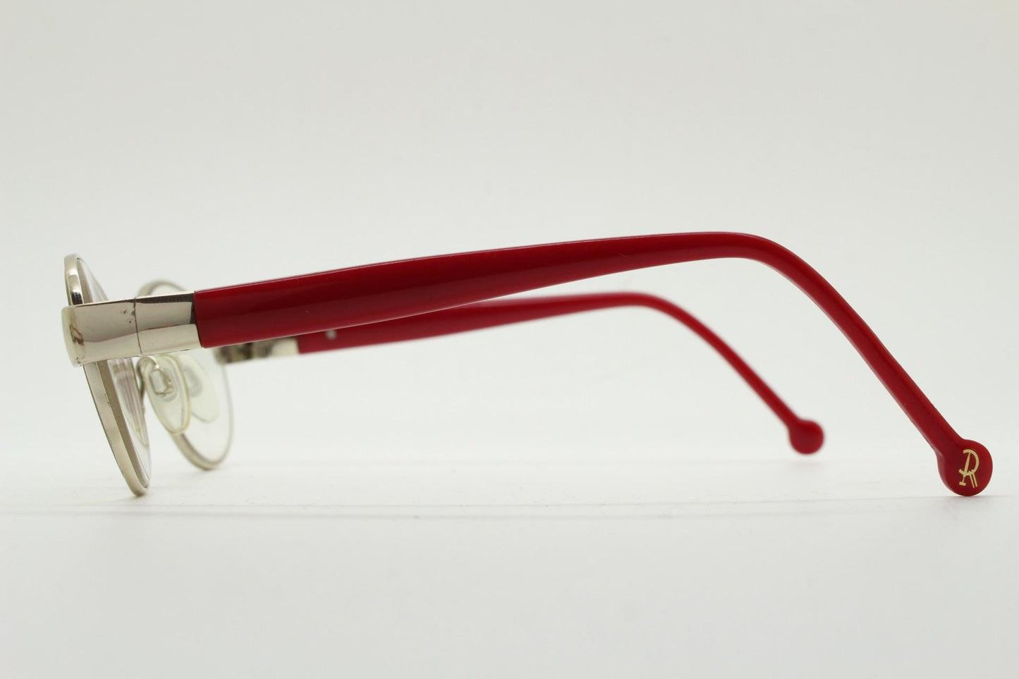 Red or Dead Y2K vintage oval eye glasses. Green or red interchangeable arms on a chrome metal frame. Optical prescription eyeglasses. RX