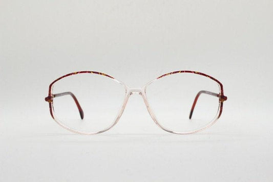Silhouette 80s vintage hexagon eye glasses made in Austria. Transparent crystal optical frame with abstract red pattern. Prescription RX