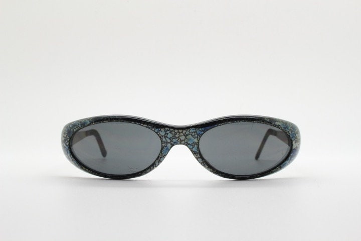 Killer Loop Shedevil 90s vintage shield sunglasses made in Italy. Low profile wrap around design with unique metallic print. One off sample