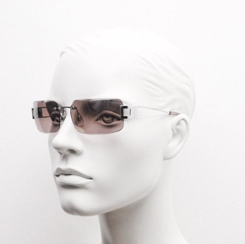 Y2K vintage rectangle frameless visor sunglasses. 2000's chrome trim wrap around with pink curved and bevelled lenses. 00's NOS
