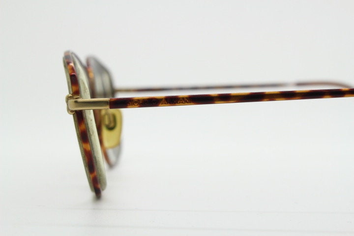 Giorgio Armani 90s vintage angular squared eye glasses made in Italy. Subtle metallic satin tiger print optical frames. Prescription RX