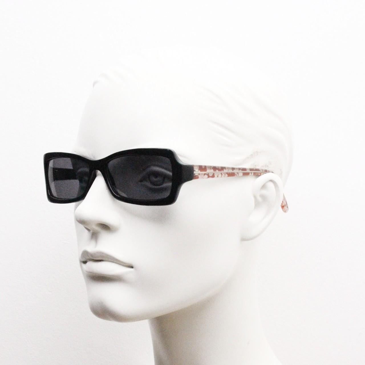 Y2k vintage rectangular cat eye sunglasses. Intense 60s style black front with and extraordinary floral arms. 2000s NOS. BNWT