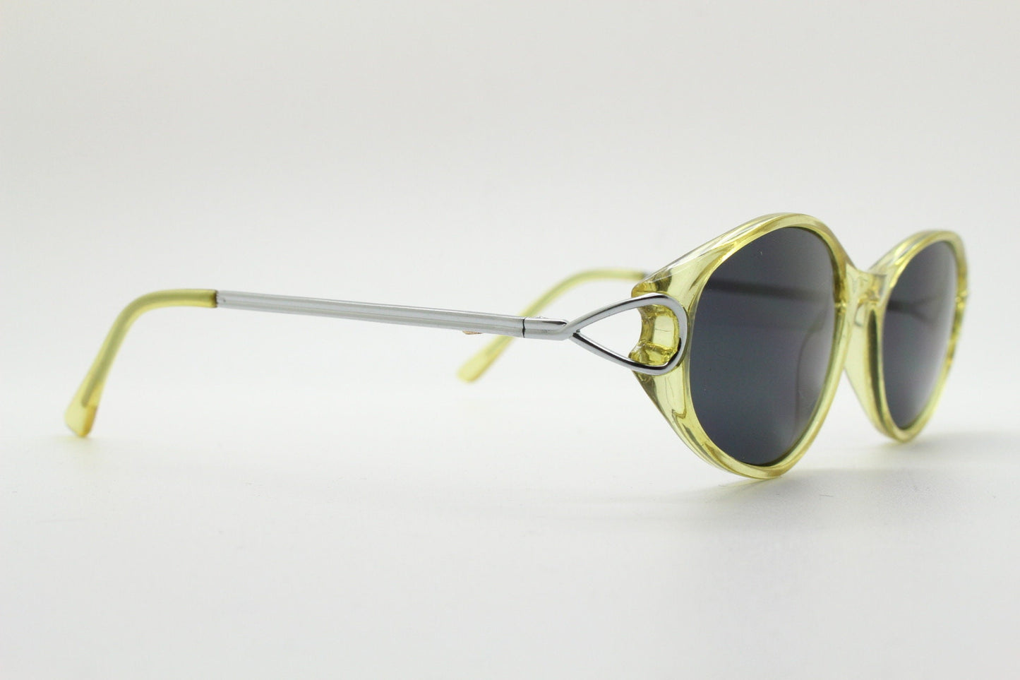 Carven Paris 90s vintage oval sunglasses. Womens transparent yellow frame with black lenses and silver metal arms. NOS