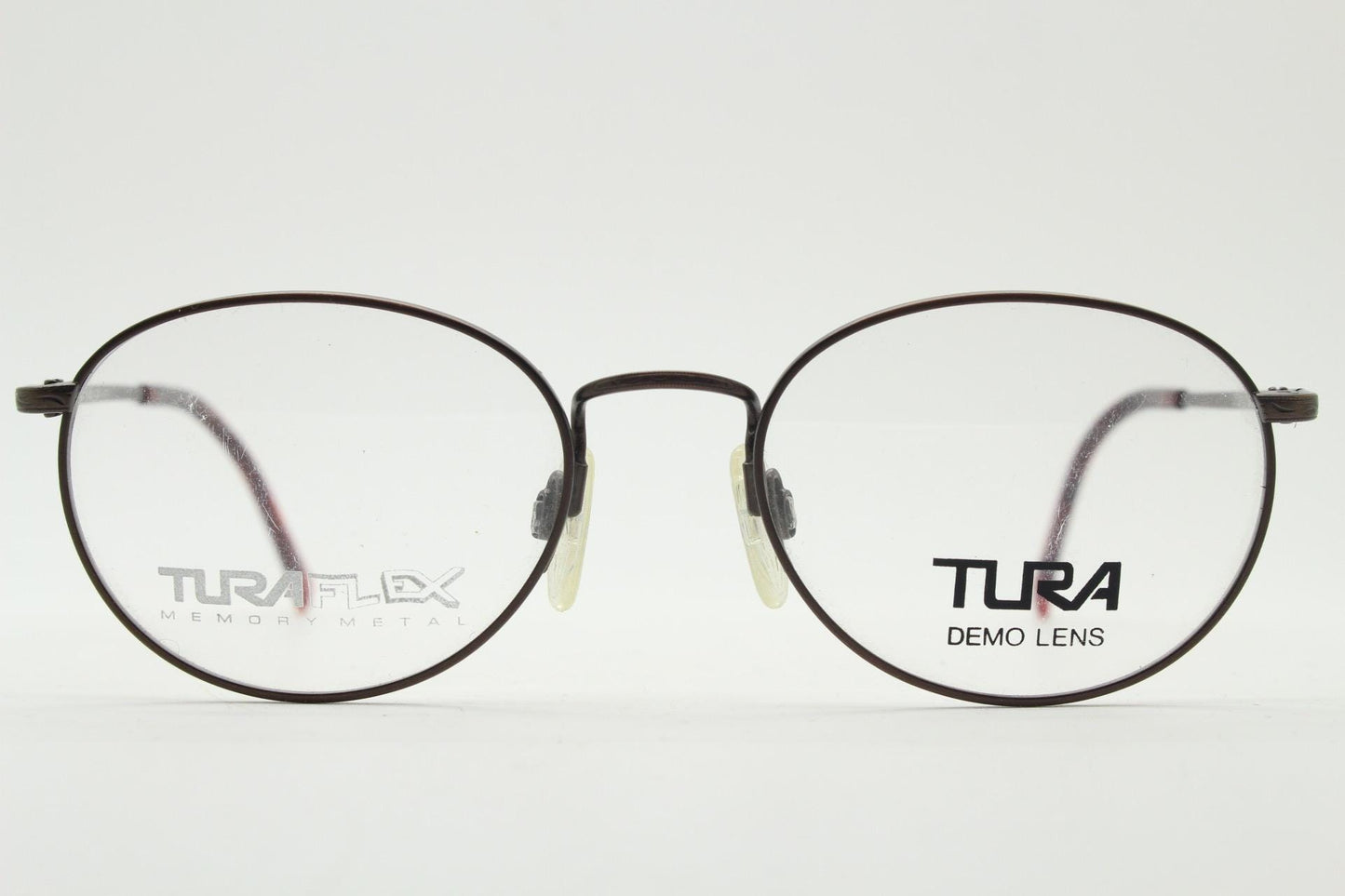 Tura 90s vintage oval eye glasses made in Japan. Satin metallic bronze finish optical frame in neat proportions. Prescription. Unused BNWT