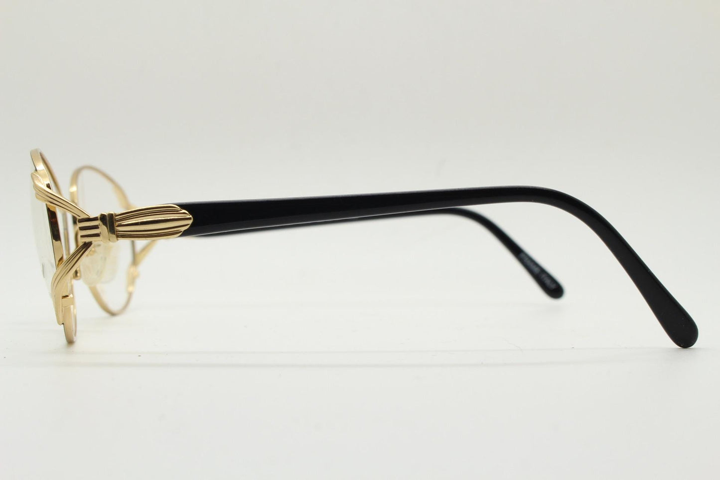Tura 80s vintage oval eye glasses made in Italy. Womens black and gold optical frame with Y forked temples. Prescription RX. Unused NOS