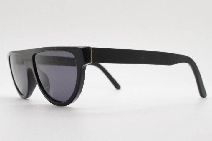 Retrosuperfuture thick flat top cat eye sunglasses hand made in Italy. All black gloss acetate frame. Vintage