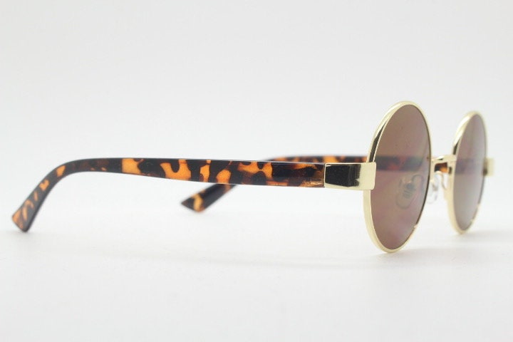 90s round vintage sunglasses. Gold 1920's style frame with tortoise arms and brown lenses. Unused. NOS. Steampunk