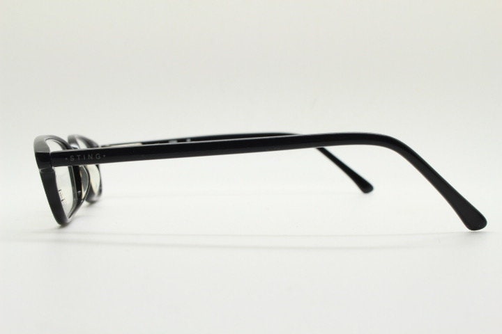 Sting 90s vintage rectangular eye glasses made in Italy. Plain black gloss low profile acetate optical frames. Prescription RX. NOS