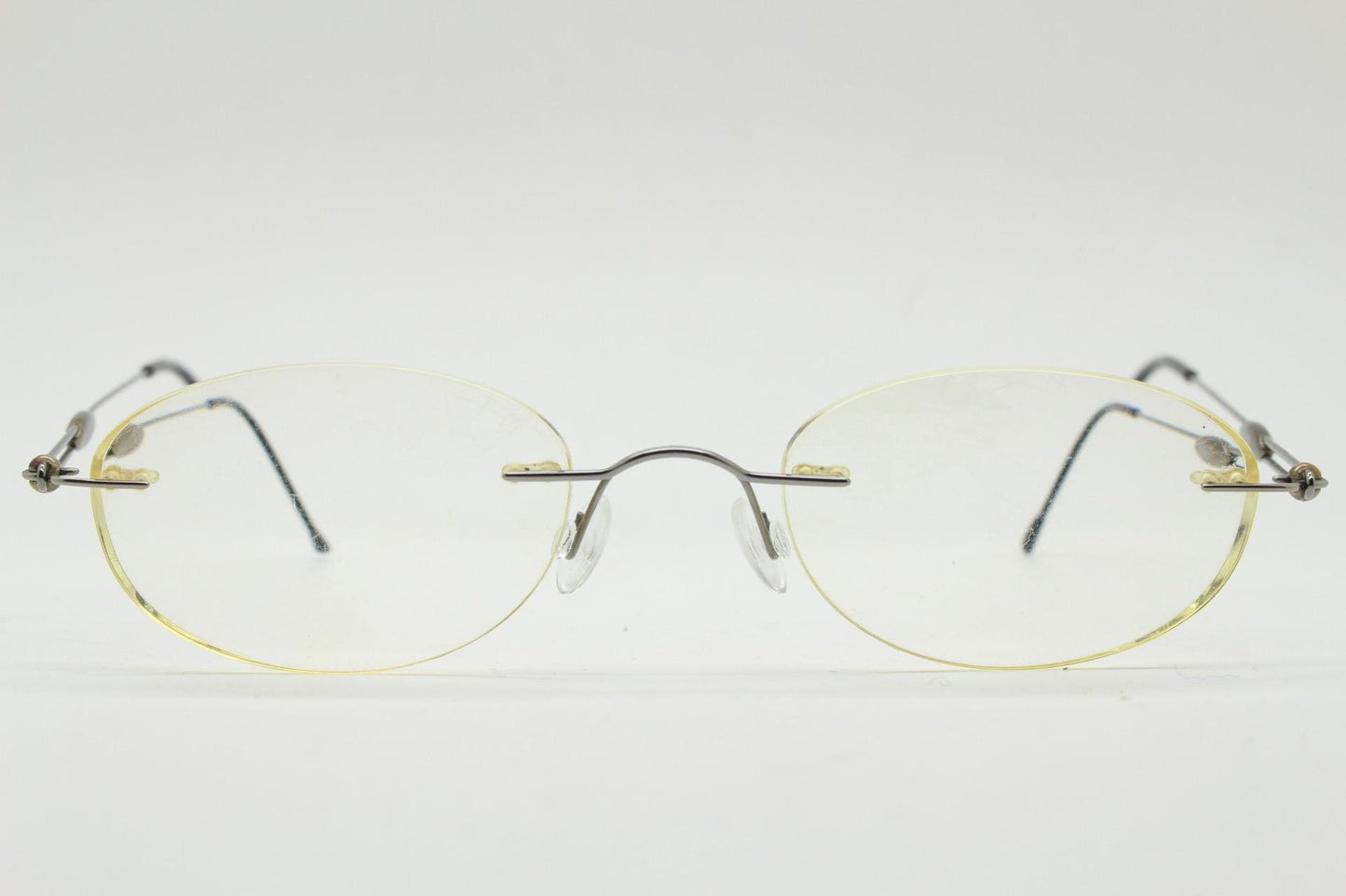 Silhouette vintage oval frameless eye glasses made in Austria. Minimal lightweight brown chrome optical frame. Prescription spectacles