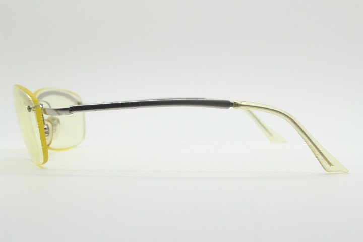 Y2K vintage half frame extra light tone yellow sunglasses with satin alloy brow line. Minimalistic 2000's wrap around design. 00's NOS
