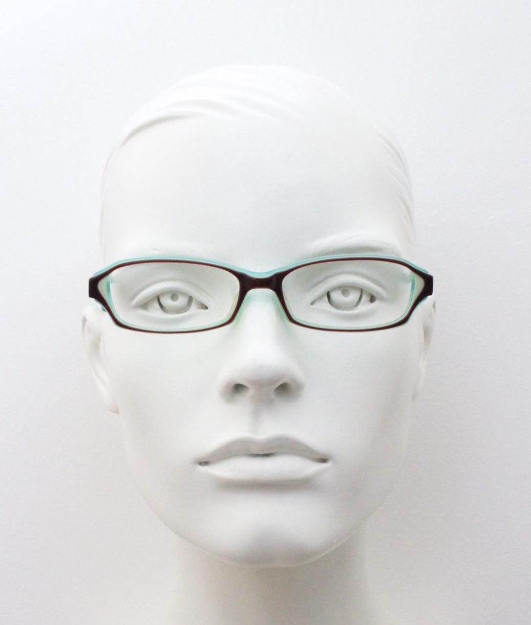 Francois Pinton Paris rectangular cat eye glasses made in Italy. Womens vibrant green acetate optical frames with brown front. Vintage
