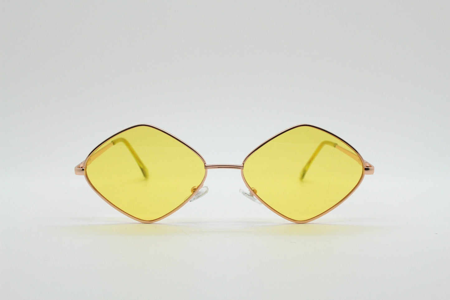 90s vintage diamond sunglasses. Minimal rose gold frame with psychedelic mod style yellow lenses. Unused BNWT