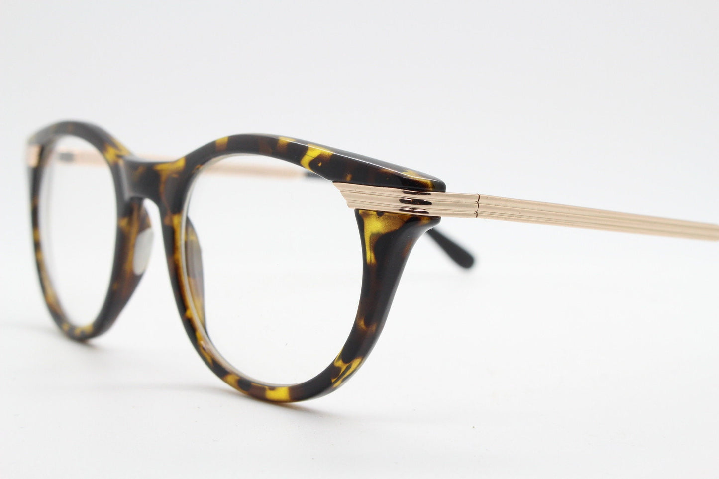 90s vintage cat eye glasses in tortoise with gold metal arms. 50s, 60s style cateye prescription optical frames. Clear lens eyeglasses. RX