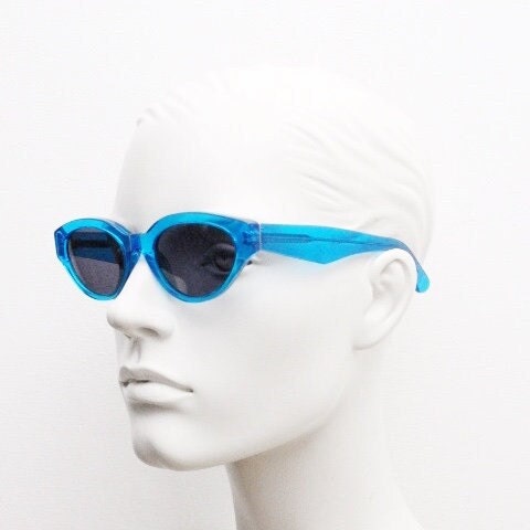Retrosuperfuture thick cat eye sunglasses hand made in Italy. Intense blue acetate chunky frame with tasteful navy lenses. NOS