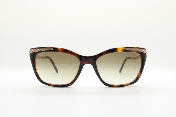 Borsalino cat eye sunglasses made in Italy model 250. Womens Tortoise acetate frame with dramatic diamante golden arms. Rhinestone cateye