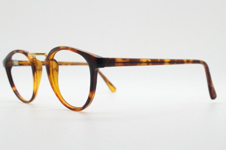 90s vintage round eye glasses. Minimal slim tortoise optical frames with gold bridge. 40s, 50s design prescription eyeglasses. RX spectacles