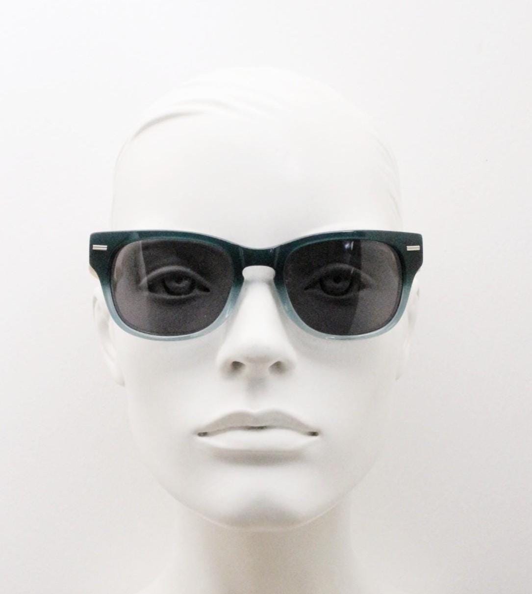 Calisons ryder modified wayfarer design sunglasses. Thickened blue acetate front with natural real wooden arms. Unused NOS