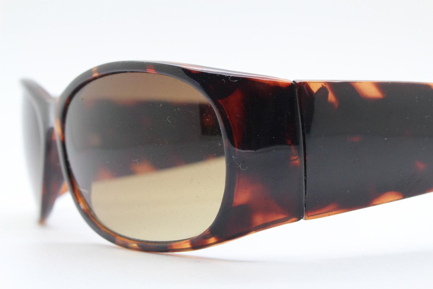 Y2k vintage wrap around bug eye sunglasses. Aerodynamic 60s design tortoise frame with full height arms in excellent proportions. 2000's NOS